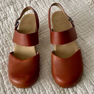 Dansko closed toe sandal with cute cutout wedge heel.